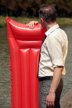 businessman with air mattress