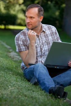 thinking man with laptop