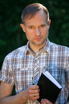 man with diary