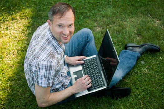 man with laptop outdoor