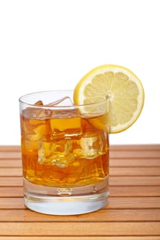 Glass of ice tea with lemon