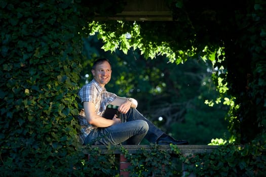 happy man with diary in green