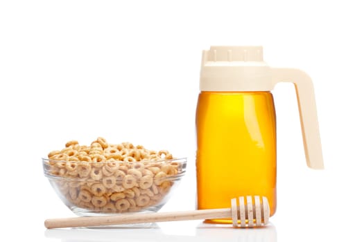 Honey pitcher and bowl of cereals