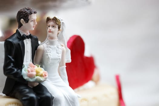 Newlyweds as cake figurines