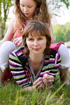 Daugther sitting on mom