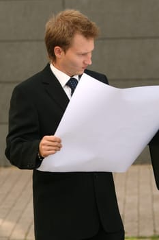 Man reads blueprints