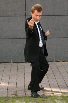 Businessman in fighting position