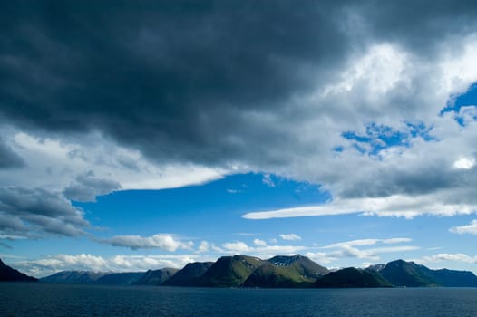Fjord,mountains,sky and clouds