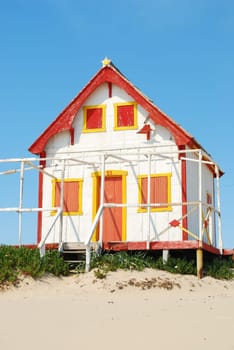 Yellow and red fisherman house