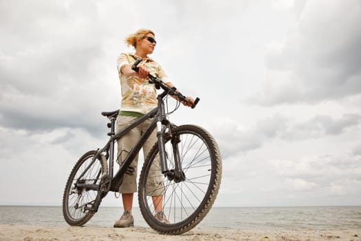 Young woman with bicycle