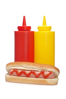 Hot dog with ketchup and mustard bottles
