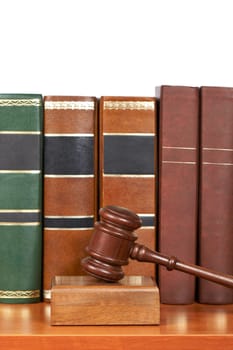 Wooden gavel and old law books