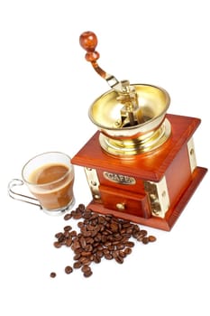 Cup, grinder, coffee pot and beans