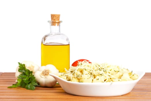 Pasta, parsley, garlics and oil bottle