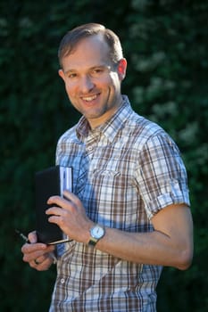 happy man with diary