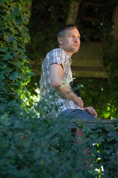 thinking man in park
