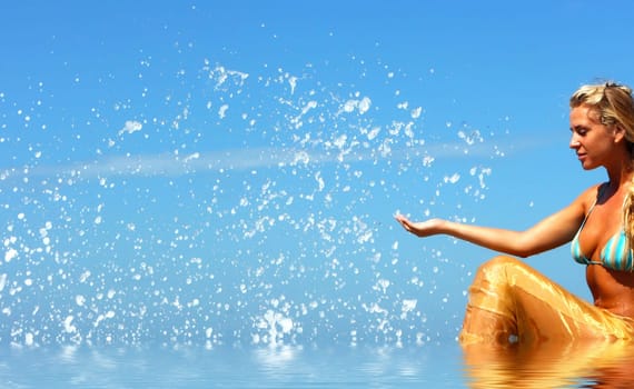 Blonde mermaid with splashes all around