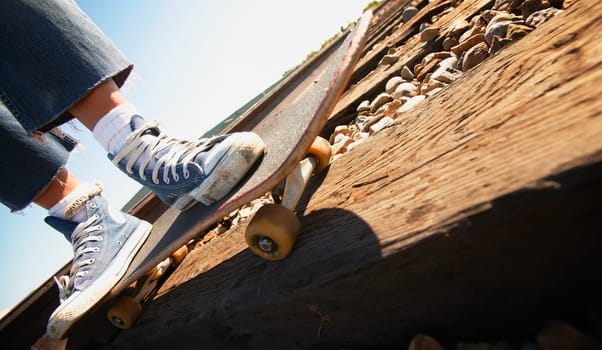 Feet on skateboard