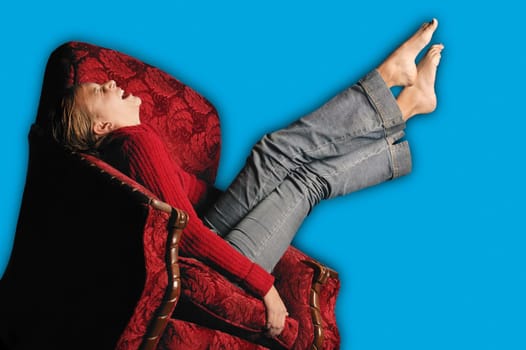 Teenage girl in armchair