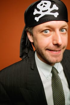 Man having fun playing a practical joke as a wacky pirate