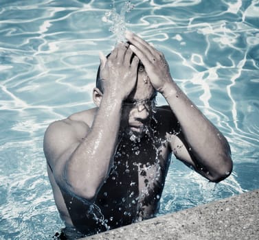 Man splashing in pool