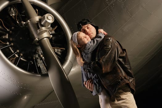 Pilot hugging child
