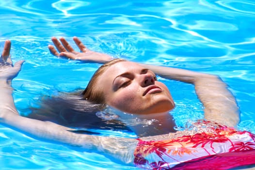Lady floating in water