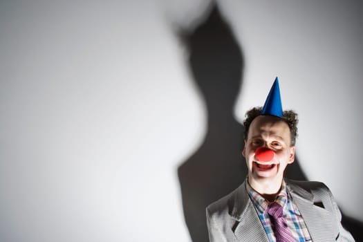 Man wearing a clown's nose and hat