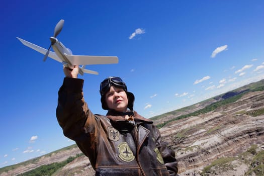 Young child playing with airplane