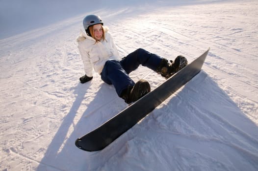 Teen on snowboard