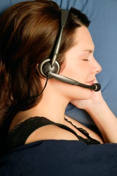 Profile of woman sleeping with headset