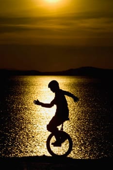 Unicycling silhouette