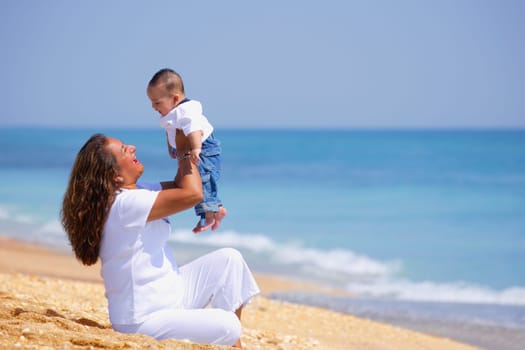Mother and infant on beach