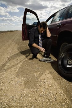 Man changing flat tire