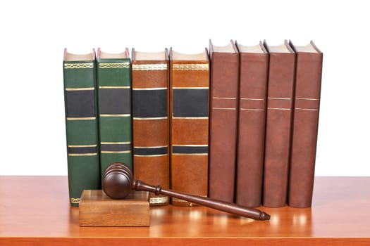 Wooden gavel and old law books