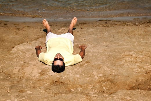 Man lying on beach