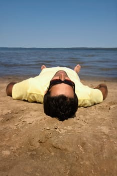 Man lying on beach