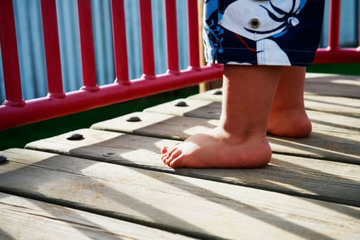 Childs feet in playground