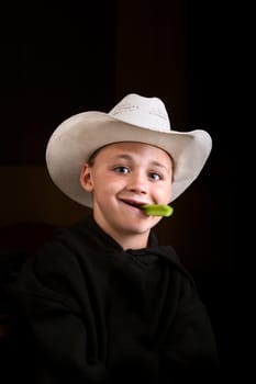 Boy eating a celery stick