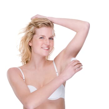 Young woman with deodorant roller