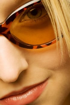Extreme close up of woman wearing sunglasses