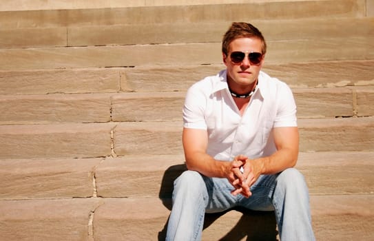 Guy sitting on steps