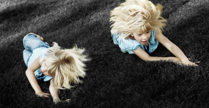 Girl rolling down a hill