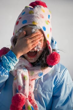 Girl playing in the snow