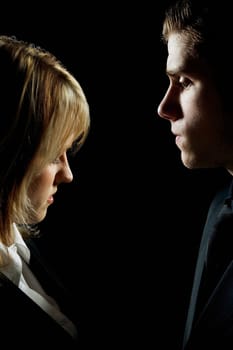 Side profile of a couple looking serious