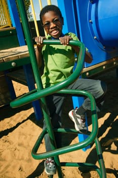 A young boy climbing on playground equipment