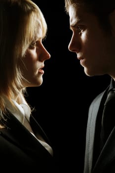 Side profile at a couple looking serious