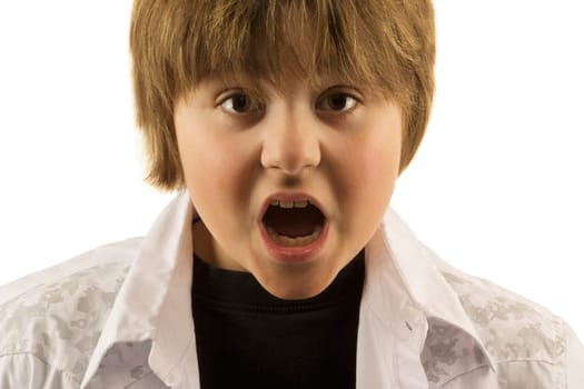 Young boy with mouth open looking surprised