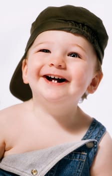 Head and shoulders portrait of a boy laughing