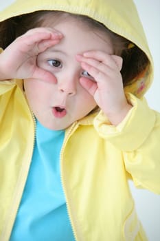 A little girl in a raincoat